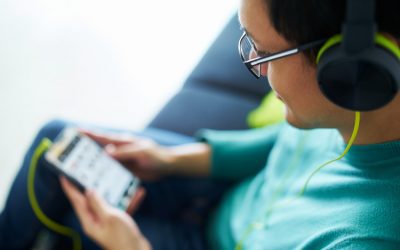 young man listening to program on phone