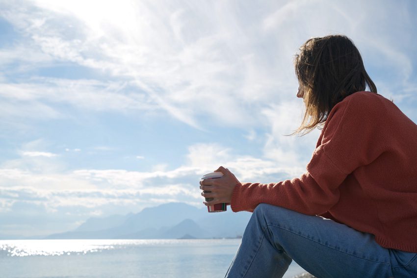 person sitting thinking with coffee - loved one